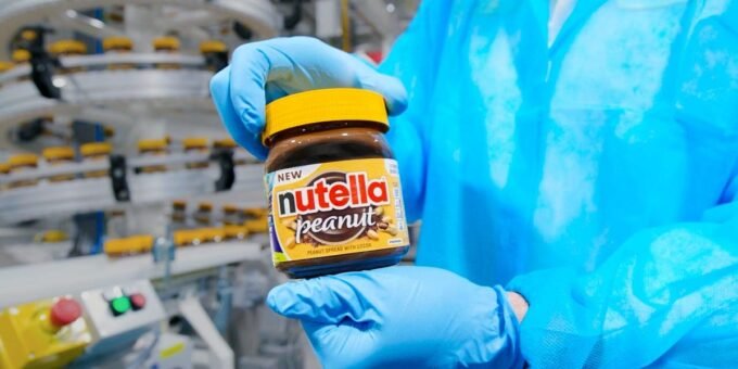 Ferrero's Sweet Ambition: How Nutella's Empire is Conquering the US Snack Market 3 Nutella jar alongside various snack products, symbolizing Ferrero's expansion into the US snack market