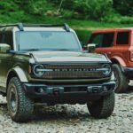 Ford Bronco Filson interior with perforated quilted leather and custom saddlebags, showcasing premium, rugged design.