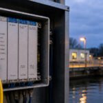 A digital representation of a Rockwell PLC connected to a vulnerable network, highlighting cybersecurity risks to industrial control systems.