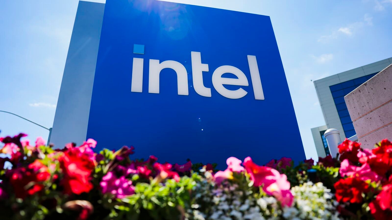 Intel logo alongside a graphic representing artificial intelligence and financial growth