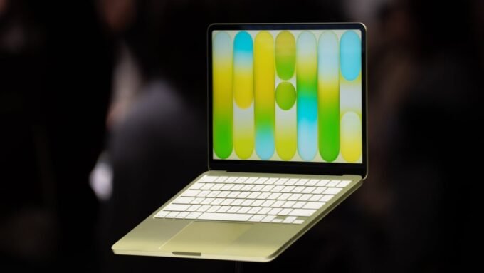 A sleek MacBook Neo laptop displayed on a desk, highlighting its design and the Apple logo, representing an affordable tech deal.