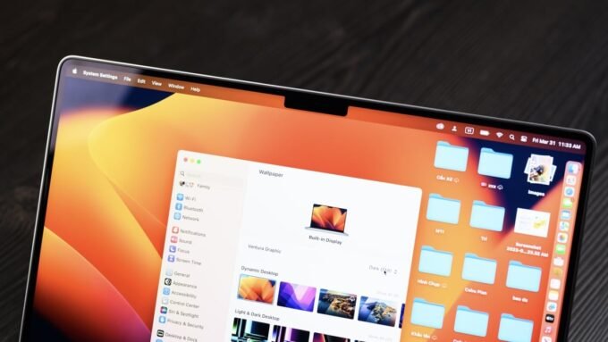 A close-up of a MacBook screen displaying a security alert or a lock icon, symbolizing the macOS screen sharing vulnerability and its fix.