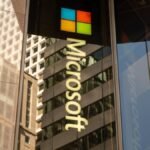 AI's Double-Edged Sword: Why Microsoft's Patch Tuesday is Swelling with Fixes 6 A digital shield protecting a network, symbolizing cybersecurity and AI's role in Microsoft Patch Tuesday updates.