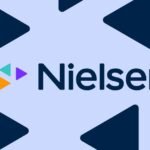Nielsen's Wearable Leap: Decoding Streaming Habits in a Fragmented Media Landscape 8 A person wearing a smartwatch, with a TV screen displaying streaming content in the background, symbolizing Nielsen's new measurement approach.