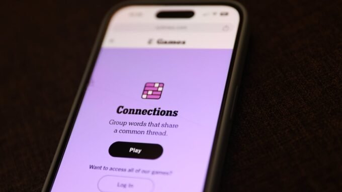 A person playing the NYT Connections word puzzle on a mobile device, illustrating the challenge of connecting words.