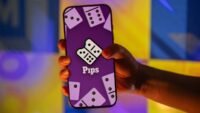 A screenshot of the NYT Pips game board showing various color-coded domino tiles and conditions.