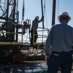Geopolitical Tensions Ease: Oil Markets React to Trump's Iran Strike Cancellation 8 An oilfield crew operates a service rig during a state-funded oil well plugging operation in Midland, Texas.