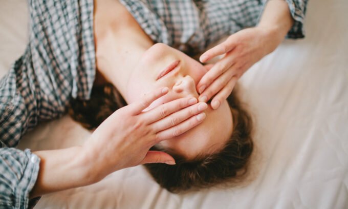 A person experiencing dizziness or lightheadedness, symbolizing the symptoms of Postural Orthostatic Tachycardia Syndrome (POTS).