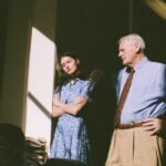Beyond the Paycheck: Unlocking Your Purposeful Career Path 8 A person looking thoughtfully at a winding path, symbolizing a career transition or journey towards a more purposeful role.
