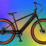 The Retrospec Joe Rev 2 (2026) Review: A Retro E-BMX That Redefines Urban Fun 6 Electric blue Retrospec Joe Rev 2 e-BMX bike being ridden on a street