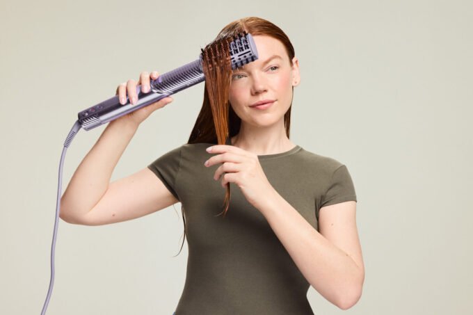 Shark FlexStyle IonCurl hair styling tool in Lilac and Strawberry Matcha colors, showcasing its sleek design and various attachments.