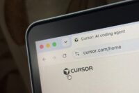 SpaceX and Cursor logos symbolizing their acquisition and partnership in AI development.