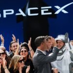 SpaceX's First Earnings: A High-Stakes Report Amidst Post-IPO Turmoil 6 Elon Musk in front of a SpaceX Starship rocket, symbolizing the company's future ambitions and current market challenges.