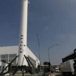SpaceX Starship rocket launch with a backdrop of a power plant, symbolizing energy needs