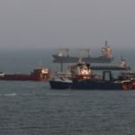 Anchored ships in the Strait of Hormuz, off the coast of Bandar Abbas, Iran, amidst escalating US-Iran tensions.