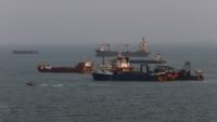 Anchored ships in the Strait of Hormuz, off the coast of Bandar Abbas, Iran, amidst escalating US-Iran tensions.