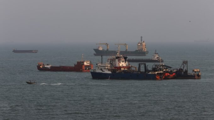 Anchored ships in the Strait of Hormuz, off the coast of Bandar Abbas, Iran, amidst escalating US-Iran tensions.