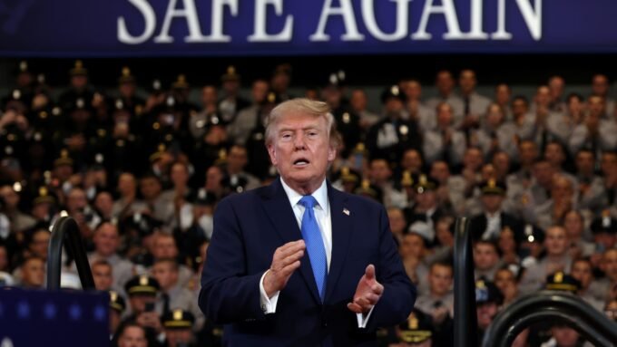 Two youths on the shoreline of Bandar Abbas, Iran, with ships anchored in the Strait of Hormuz, and U.S. President Donald Trump delivering remarks in Garden City, New York.