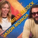 Milly Alcock as Supergirl and Jason Momoa as Lobo in a promotional image for the new DC movie, discussing the themes of kindness and niceness.