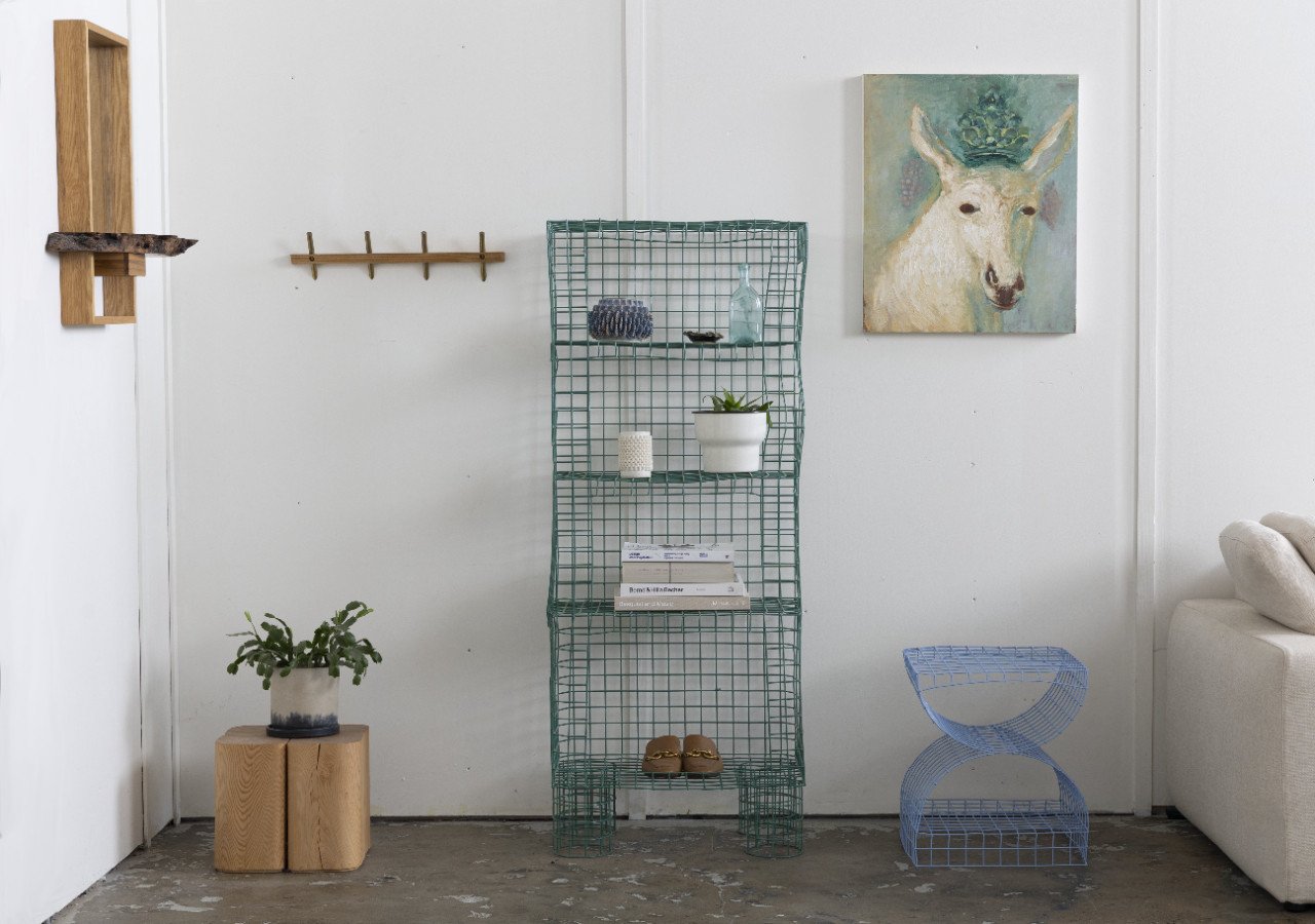 A collection of stylish and sustainable home furnishings, including a modern vase, an outdoor solar lamp, and a wooden bed frame.