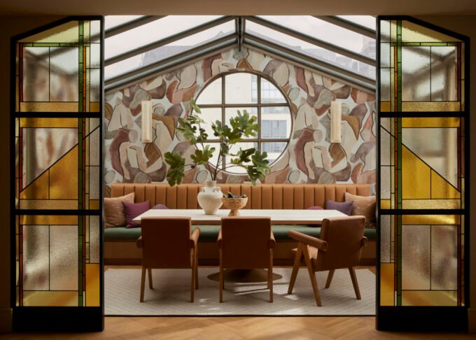 Luxurious Toronto penthouse interior featuring curved walls, earthy tones, and modern 1980s design elements by Dvira Interiors.