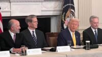 Former President Donald Trump shaking hands with a group of cryptocurrency CEOs at a White House meeting.
