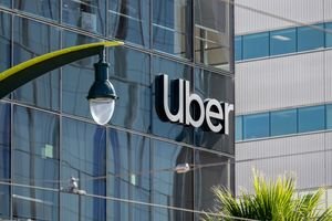 An Uber robotaxi, possibly a Pony.ai vehicle, driving through a European city street, symbolizing the expansion of autonomous ride-hailing services.