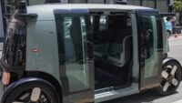 Amazon Zoox autonomous robotaxi driving on a street in Las Vegas