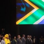 Le président Cyril Ramaphosa et d'autres membres de l'ANC lors d'une séance parlementaire au Cap, symbolisant les défis politiques actuels du parti.