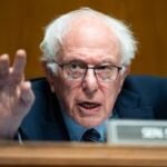 Bernie Sanders and Steve Bannon speaking at a rally for AI oversight
