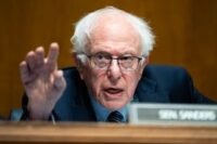 Bernie Sanders and Steve Bannon speaking at a rally for AI oversight