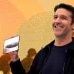 Apple CEO John Ternus holding the new foldable iPhone Duo, with the iPhone 18 Pro and Pro Max in glacier color also visible.