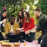 A vibrant birthday celebration with music notes and confetti, symbolizing diverse and joyful birthday songs.