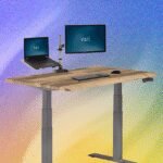 Elevate Your Workspace: The 10 Best Standing Desks of 2026 6 A modern standing desk with a computer setup, transitioning between sitting and standing positions.
