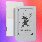 The Boox Picco, a tiny e-reader, shown attached magnetically to the back of a smartphone.
