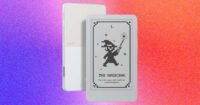 The Boox Picco, a tiny e-reader, shown attached magnetically to the back of a smartphone.