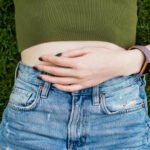 A woman experiencing chronic pelvic pain, highlighting the complex interplay of physical and psychological factors.