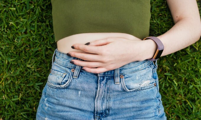 A woman experiencing chronic pelvic pain, highlighting the complex interplay of physical and psychological factors.