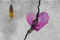 A woman looking thoughtfully into the distance, symbolizing reflection and new beginnings after a divorce.