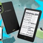 A collection of e-reader gifts including a small e-reader, a remote page turner, and a tablet pillow stand.
