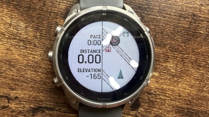 Close-up view of the Garmin Fenix 9 Pro Solar 47mm Titanium GPS Smartwatch on a wrist, displaying a map or activity data.