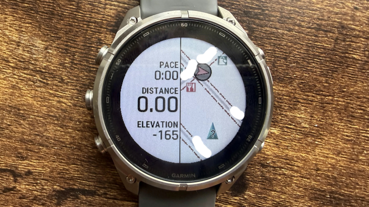 Close-up view of the Garmin Fenix 9 Pro Solar 47mm Titanium GPS Smartwatch on a wrist, displaying a map or activity data.