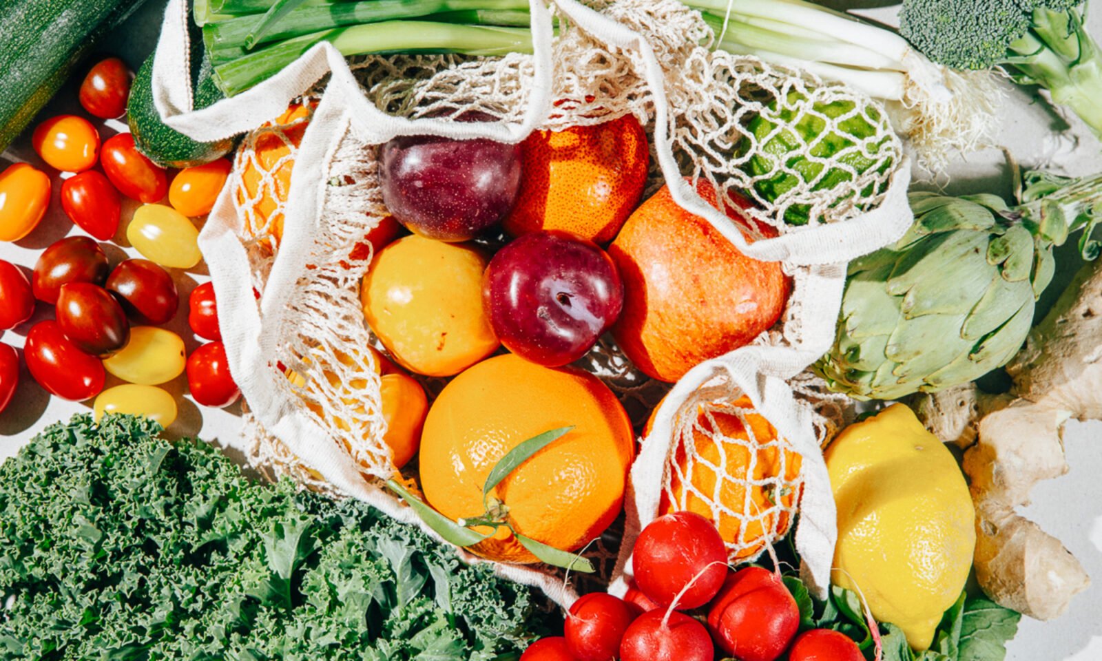 Blood sample vials and healthy food items representing a diet study on aging.