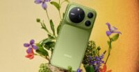 Honor Magic 9 Pro Max smartphone in mossy green, showcasing its large circular camera module.