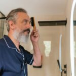 The Midlife Testosterone Mystery: It's More Than Just Age 6 A man in his 50s contemplating his health, representing the complexities of midlife testosterone levels.