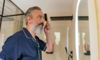 A man in his 50s contemplating his health, representing the complexities of midlife testosterone levels.