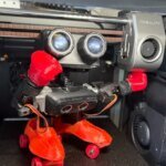 Diverse robots and tech enthusiasts interacting at Maker Faire Bay Area in the Foundry