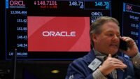 An Oracle logo displayed on a trading screen at the New York Stock Exchange, reflecting the company's stock performance.