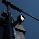 Automatic License Plate Reader (ALPR) camera, symbolizing the ongoing debate over police surveillance and data privacy.
