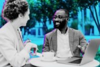 A diverse group of entrepreneurs discussing investment strategies around a table, symbolizing private capital collaboration.